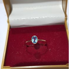 14k solid yellow gold natural oval shaped blue topaz semi precious gemstone ring. 1. The weight of the natural blue topaz gemstone used in the ring =0.50 cts. 2. The weight of the 14k solid yellow gold used in the ring =0.810 grms. The blue topaz gemstone is the birthstone for the people born in the month of November. The ring is very nice and beautiful. Thanks Oval Topaz Birthstone Ring In Yellow Gold, Dainty Oval Topaz Gemstone Ring, Dainty Oval Topaz Ring, Oval Topaz Yellow Gold Jewelry, Oval Topaz Jewelry In Yellow Gold, Dainty Oval Sapphire Ring For Formal Occasions, Oval Blue Topaz Birthstone Jewelry, Dainty Oval Topaz Birthstone Ring, Gold Oval Blue Topaz Birthstone Ring