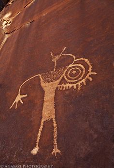 a rock with a drawing of a man on it