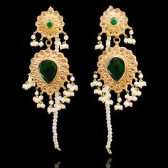 A refined glamour with a modern sensibility! The look includes earrings and teekah. An utterly classic pair of earrings showcasing kundan stones, alluring emeralds and delicately bunched pearl moti along with a beautiful and full of sparkle maang teekah handcrafted with kundan stones and dangling emerald beads. Approximate earrings length is 3". Gold-plated on high-quality brass as base metal. Made by order. Kindly allow 5-7 weeks for the delivery of this item. For custom or urgent requests, ple Elegant Green Kundan Chandelier Earrings, Elegant Green Tikka With Tilla Detail, Elegant Green Kundan Tikka, Elegant Green Kundan Bridal Earrings, Elegant Green Kundan Necklace With Latkans, Elegant Pearl Drop Tikka For Festive Occasions, Elegant Green Jhumkas For Wedding, Elegant Wedding Pearl Earrings With Cutdana, Elegant Green Chandbalis For Wedding