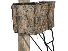 a tree stand with a camouflage cover on it