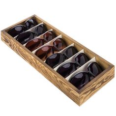 six pairs of sunglasses in a wooden box