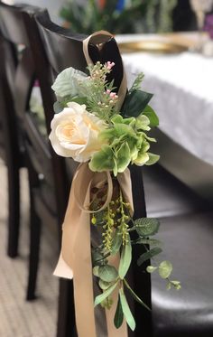 a bouquet of flowers sitting on top of a chair