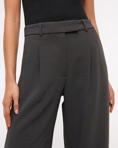 High rise pants in our elevated premium crepe fabric and ultra-wide leg silhouette, that has a slightly fuller leg shape than our Sloane pant. Features a clean fixed waistband, figure-flattering pleat detail, pockets and a functional zipper. Modern Wide Leg Bottoms With Pressed Crease, Modern Wide Leg Pants With Pressed Crease, Modern Wide Leg Elastane Pants, Modern Wide-leg Elastane Pants, Wide Leg Elastane Pants With Belt Loops, Women's Bottoms, Ultra Wide, High Rise Pants, Crepe Fabric