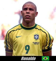 a soccer player is looking at the camera while wearing a yellow and green uniform with number 9 on it