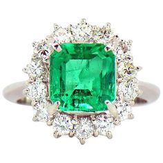 Natural Colombian Emerald & Diamond Halo ring is just stunning. The ring features a 2.64 carat natural square Emerald cut in the center Surrounded by a beautiful diamond halo. The 2.64 carat center Colombian Green Emerald is accompanied by GIA Emerald Origin report. This is a very fine Colombian Emerald with a lot of fire & vibrant green color, a real Gem. The 14 round brilliant diamonds on the Halo are G in color, VS in clarity and the total diamond carat weigh is 0.94 ct. The ring is crafted i Used Engagement Rings, Colombian Emerald Ring, Jewelry By Brand, Diamond Platinum Ring, Hey Friend, Lucky Brand Jewelry, Platinum Diamond Rings, Diamond Halo Ring, Colombian Emeralds