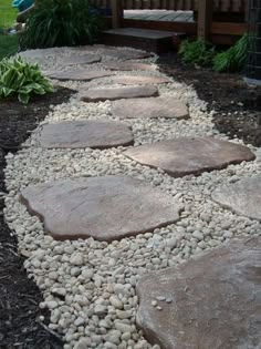 a walkway made out of rocks and gravel