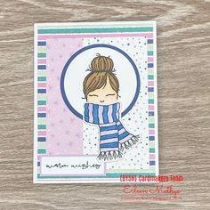 a handmade card with a girl wearing a blue and white striped scarf on it