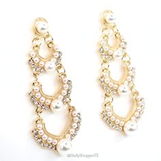 These Are Brand New Women's Faux Pearl Clear Glass Rhinestone Gold Tone Tiered Drop Statement Earrings. These Stunning Earrings Feature White Faux Pearls In Multiple Sizes With Sparkly Clear Glass Rhinestones Set On A 3 Tiered Gold Tone Drop Stud. These Earrings Are Gorgeous In Person And Perfect For A Special Occasion! All Orders Are Packaged With And Are Shipped Out Asap! Questions? Leave Us A Comment! We Are More Than Happy To Help! New To Poshmark? Use The Invite Code Dailyshopper73 When You Glamorous Pearl Chandelier Earrings For Parties, Elegant White Chandelier Earrings With Rhinestones, Glamorous White Crystal Earrings With Bling, Glamorous Pearl Crystal Earrings For Party, White Rhinestone Chandelier Earrings For Party, White Bling Bridal Earrings For Party, Elegant White Bling Earrings, Glamorous White Metal Chandelier Earrings, White Rhinestone Chandelier Earrings For Evening