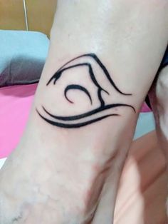 a person with a tattoo on their foot