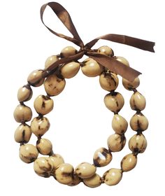 New Best Quality 32" NATURAL Kukui Nut Necklace Lei 20 pcs Wholesale (20 pcs) Polished Quality Nuts. Custom Hand Sorted Heart-Shaped Nuts. Hand-Crafted by Native Island Artisans. Adjustable Fine Satin Ribbon Tie. Perfect Wardrobe Accessory. Every piece has unique character. Great gift for wedding, graduation, gift. Free Shipping in United States from Pearl City, Hawaii ! Kukui Nut Lei, Pearl City Hawaii, Hawaiian Gifts, Kukui Nut, Rainbow Crafts, Gift For Wedding, Wardrobe Accessories, Hawaiian Wedding, Maui Weddings