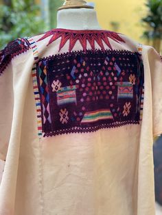 Beautiful huipil with intricate Guatemalan motifs for use by cofrades in the traditional purple used for ceremonies . This huipil is circa 1970 . The huipil was made in Chichi by local artisans in charge of religious affairs. This huipil was hand woven on a back strap loom in white cotton base panel and silk thread. The hand embroidered collar is unique to these huipils and this example is particularly fine. Is an beautiful piece although pre loved it keeps it bright color, it has some bleed fro Embroidered Collars, Local Artisans, Silk Thread, Womens Tunics, Bright Color, Back Strap, Guatemala, White Cotton, Hand Woven