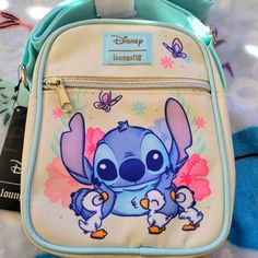 Awesome Disney Stitch Crossbody Bag. It Has A Large Zipper Compartment And A Small Zipper Compartment On The Front And A Adjustable Strap. Great For Everyday Use Or For Travel. Disney Blue Shoulder Bag For Travel, Disney Character Print Bags For Disney Trips, Blue Bags With Character Print For Everyday Use, Disney Style Shoulder Bag With Removable Pouch, Blue Disney Bag With Zipper Closure, Disney Blue Bags With Zipper Closure, Blue Disney Bags With Zipper Closure, Cute Blue Bag For Disney Fan Events, Disney Shoulder Bag For School With Adjustable Strap