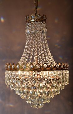 a crystal chandelier hanging from the ceiling