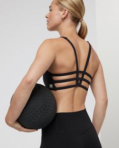 Classic medium-cut front with a strappy back, the Yosemite Sports Bra is up for adventure. Great for hiking, training and traveling. | Vuori Yosemite Bra | Black | XS Vuori makes premium performance apparel inspired by the active Coastal California lifestyle; an integration of fitness, surf, sport, and art. Breaking down the boundaries of traditional activewear, we are a new perspective on performance apparel. Training Activewear With Mesh And Strappy Back, Black Strappy Back Activewear For Yoga, Athleisure Activewear With Mesh And Strappy Back, Black Athleisure Sports Bra With Tank Straps, Athleisure Activewear With Mesh Strappy Back, Sporty Strappy Sports Bra With Adjustable Straps, Athleisure Black Sports Bra With Tank Straps, Black Compressive Activewear With Tank Straps, Sporty Strappy Mesh Back Sports Bra