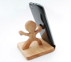 a wooden stand with a cell phone on it