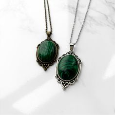 Malachite Pendant Necklace | Antique Silver or Gold | 24" Chain Clairvoyance + Transformation + Road Opener + Emotional Balance Carry your intentions wherever you go with a handmade Malachite pendant necklace. Each pendant is custom made with an antique gold or silver filigree base and comes with an 24" chain with lobster clasp fastening. Malachite is often referred to as the Stone of Transformation. It was a stone favored by the ancient Greeks and Egyptians for its protective and healing properties. Malachite is a heart chakra stone that works by removing whatever is blocking growth in your life and opening your heart and mind to new possibilities. Whether you are ready to take a leap of faith or feeling stagnant in life, this stone will give you clarity of purpose and the courage to move Oval Malachite Necklace As Gift, Vintage Malachite Jewelry For Gifts, Vintage Malachite Jewelry Gift, Feeling Stagnant, Road Opener, Take A Leap Of Faith, A Leap Of Faith, Pick Your Poison, Malachite Pendant