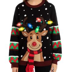 a woman wearing a christmas sweater with reindeer lights on it