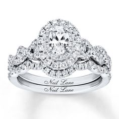 an engagement ring with two halos and the words neil lane engraved in white gold