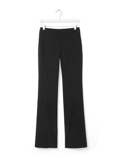 Meet our new menswear-inspired trouser: the Logan. These lightweight black wool trousers have a contoured waistband that molds to your body | Banana Republic Straight Silhouette Dress Pants With Belt Loops For Office, Sleek Fitted Straight Bottoms, Straight Silhouette Pants With Belt Loops, Tailored Straight Pants For Office, Tailored Straight Office Pants, Tailored Straight Pants For Work, Fitted Bottoms With Button Closure And Straight Hem, Business Casual Pants With Belt Loops And Straight Silhouette, Fitted Straight Pants With Pockets