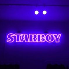 a neon sign that says starboy on it