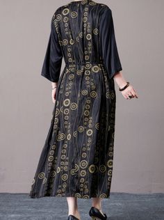 Step out in style with this black and gold geometric print maxi dress. Featuring a striking geometric pattern and a flattering V-neckline, this dress exudes elegance and sophistication. The cinched waist and flowing silhouette provide a comfortable and chic fit, perfect for both formal occasions and stylish everyday wear. Pair with bold accessories and heels for a complete, polished look. Key Features: Black and gold geometric print V-neckline for a flattering look Cinched waist for a chic fit Flowing silhouette for comfort Suitable for formal occasions and everyday wear Black Geometric Pattern Dress For Spring, Black Spring Dress With Geometric Pattern, Spring Black Dress With Geometric Pattern, Black Geometric Pattern Spring Dress, Black Bohemian Dress With Geometric Pattern, Black Dress With Geometric Pattern, Geometric Pattern V-neck Midi Dress, Black Geometric Pattern Dress, Chic Black Maxi Length V-neck Dress