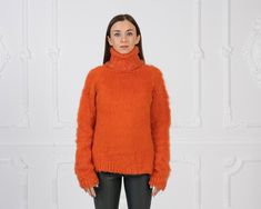 "MATERIAL : 2 strands Extra Fine Merino wool COLOUR : Orange ( There may be a slight difference because of the different monitors' representation) ♥ In the picture the model is wearing a garment with these measurements : A: ( Body lenght) : 26 \" / 66 cm B: ( Chest width) : 17.3 \" / 44 cm C: (Sleeve from under the arm) : 22.4 \" / 57 cm D: (Neck unrolled) : 12.6 / 32 cm. They are taken with the item laid flat and not streched. ♥ For choosing your size please look at size chart in our listing pi Fine Knit Mohair Tops For Fall, Fine Knit Mohair Sweater For Fall, Long Sleeve Mohair Top For Fall, Winter Fine Knit Mohair Tops, Winter Mohair Knitted Tops, Mohair Turtleneck Sweater For Fall, Fall Knitted Mohair Tops, Fall Mohair Turtleneck Sweater, Fall Turtleneck Mohair Sweater