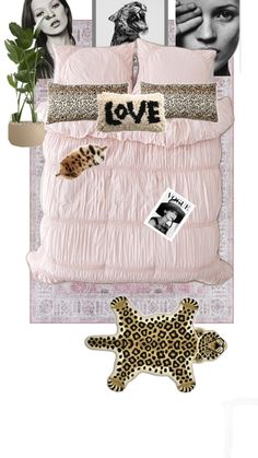 a bed with pink comforter and pictures on the wall above it, along with a starfish rug