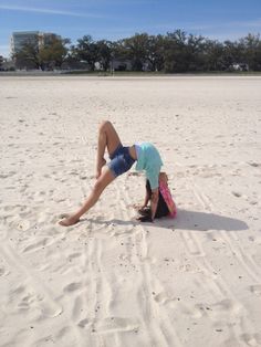 a young child is playing in the sand