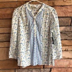 Nwt White With Blue And Green Floral Print Lucky Brand Boho Style Top. Sleeves Are Cropped And Have A Buttons That Can Be Opened Up. Buttons Half Way Down The Front. Very Light And Flowy Material. Slight Pleating Around The Shoulder Seams. Women’s Size L. Retail Is $80 Vacation Blue Floral Print Peasant Top, Vacation Blue Floral Peasant Top, Blue Bohemian Peasant Top In Relaxed Fit, Blue Bohemian Peasant Top With Relaxed Fit, Blue Boho Print Peasant Top, Blue Boho Print Peasant Top For Beach, Spring Blue Peasant Top For Daywear, Blue Peasant Top With Floral Print, Blue Floral Print Peasant Top