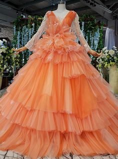 an orange dress on display in a store