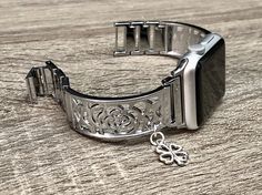 High Quality Premium Shiny Silver Color Band for Apple Watch All Series Comfortable Bangle with Secure Clasp Lock, Includes Extra Links and Pins Tool to Resize Wristband To Preferred Fitment Adjustable Size Fits 5.5 to 8 Inches (need to add or remove extra links) Super Light Bracelet - Weighs Around 1.2 oz 18mm Wide, Designed And Handmade by Simeon D Jewelry Not For Other Models. Tracker Is NOT Included Follow my Studio for Updates & New Designs Elegant Silver Adjustable Apple Watch Band, Silver Adjustable Rectangular Watch Bands, Silver Apple Watch Bracelet Strap Band, Adjustable Silver Bracelet Apple Watch Band, Silver Bracelet Strap Apple Watch Band, Adjustable Silver Bracelet Strap Apple Watch Band, Adjustable Silver Bracelet Strap Watch Bands, Adjustable Stainless Steel Apple Watch Band For Gift, Adjustable Stainless Steel Apple Watch Band Gift