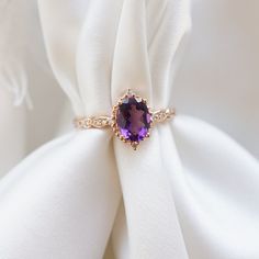 "♥ Lilia Feel the smell of lilies of the valley and imagine a luxurious velvety purple engagement ring on your left hand-It sounds like a matchy match for romantic souls. We present you \"Lilia\", our gentle and charming ring choice for the future brides. The oriental amethyst gem surrounded by genuine diamonds completes the image of unconditional love of those who are about to get engaged. The special and feminine \"Lilia\" will always get her Prince Charming. ---------------------------------- Amethyst Engagement Ring Vintage, Purple Engagement Rings, Gem Engagement Rings, Amethyst Wedding Rings, Gemstone Jewelry Earrings, Amethyst Engagement Ring, Raw Crystal Ring, Antique Engagement Rings Vintage, Amethyst Ring Engagement