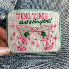 someone is holding up a patch that says, tint time that's the spirit