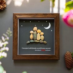 there is a framed picture with some rocks in it