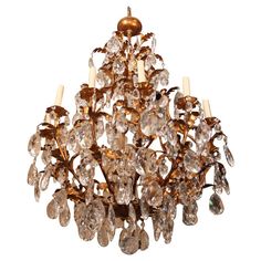 an antique chandelier with many crystal drops