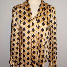 Elie By Elie Tahari Misses Sizes Fashion Blouse Multi-Color Geometric Print On Brown, Yellow/ Gold And Tan Long Sleeves With Single Button Cuff Pull-Over Style V-Neckline Attached Necktie Can Be Worn Various Ways 100% Polyester New With Tags Chic Multicolor Tops With Geometric Pattern, Multicolor Geometric Pattern Blouse For Workwear, Multicolor Workwear Blouse With Geometric Pattern, Multicolor Geometric Pattern Workwear Blouse, Chic Multicolor Blouse With Geometric Pattern, Elegant Fitted Tops With Geometric Pattern, Spring Workwear Blouse With Geometric Pattern, Elegant Long Sleeve Top With Geometric Pattern, Elegant Long Sleeve Tops With Geometric Pattern