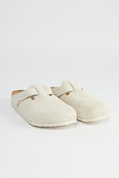 Classic Birkenstock Boston clogs with a soft footbed. Essential suede clogs with buckle closures at the sides. Features a molded footbed for comfortable wear and a textured EVA outsole. Features Birkenstock Boston soft footbed clog Slip on suede clogs Buckle side closure Molded footbed Textured outsole Content + Care Suede, leather, rubber Spot clean Imported Size + Fit Birkenstock regular width Fits like a medium D width | Birkenstock Boston Soft Footbed Clog in White, Men's at Urban Outfitters White Birkenstock Clogs Outfit, Winter Fall Shoes, White Boston Clogs, Birkenstock Clogs Colors, Cute Birkenstocks, White Birkenstock Clogs, Birkin Stocks, Birkenstock Boston’s, Shoes To Get