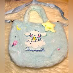 New, Unused Cinnamoroll Fuzzy Purse With Button Enclosure, Adjustable Strap, And 3d Star On Outside Of Bag Dimensions: 10.6 Inch X 7.8 Inch X 3.5 Inch Cute Blue Bags For Daily Use, Cute Blue Bag For Daily Use, Cute Light Blue Everyday Bag, Cute Light Blue Everyday Bags, Cute Light Blue Bag For Daily Use, Kawaii Light Blue Bags For Everyday Use, Kawaii Light Blue Bag For Everyday Use, Light Blue Kawaii Bag For Everyday, Light Blue Kawaii Bag For Everyday Use