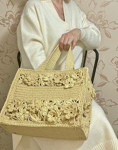 Inspired by famous brand I made this boho floral tote bag. Let yourself feel unique and fashionable with this exclusive crochet tote bag, this custom crochet bag ideal for going to beach, shopping or as a great gift for your loved one. This shoulder crochet bag will be stylish part of your look.   You can order bag with or without personalization. Bag with personalization will cost a little bit more but you will have your unique bag.  This bag has felt lining and includes two big pockets.  FREE worldwide shipping.  Please feel free to contact me with any question. Material: soft raffia, felt 100% Vegan Size: 25 cm x 35cm x 14 cm (9.8  widht x 13.7 height x 5.5 depth ) It might be a little difference because of natural material.  Please do not wash it. Chic Yellow Crochet Tote Bag, Trendy Hand Knitted Tote Shoulder Bag, Hand Knitted Summer Bag, Yellow Crochet Tote Bag For Spring, Chic Yellow Rectangular Crochet Bag, Bohemian Crochet Bag With Large Capacity And Double Handle, Large Capacity Cream Crochet Bag Bohemian Style, Bohemian Crochet Bag With Double Handle And Large Capacity, Large Capacity Cream Crochet Bag In Bohemian Style