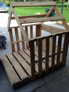 a wooden crate sitting on top of a sidewalk