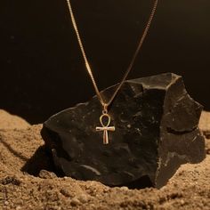 This solid gold key of Ankh necklace showcases exquisite craftsmanship, symbolizing life and spirituality. The key of Ankh pendant is more than just jewelry; it's a fine representation of ancient Egyptian elegance and the timeless allure of this sacred symbol. PENDANT INFORMATIONThis pendant is made of real, solid gold.• Made in USA• Size: MINI• Material: 14k or 18k solid gold• Finish: polished• Height: 1.12" (28 mm) x Width: 0.54" (16 mm)• Pendant weight (approx.): 3 grams (14k)• Bail: fits up to 4 mm chains• Solid back, not hollow• A certificate of authenticity is included• Delivered in our elegant jewelry box, making it the perfect giftPlease note: Our Mini sized pendants are small and delicate pieces - please verify the dimensions before placing your order.Shipping:All of our orders ar Symbolic Ankh Jewelry For Meditation, Symbolic Ankh Brass Necklace, Amulet Style Ankh Necklace In Brass, Spiritual Ankh Necklace In Yellow Gold, Yellow Gold Ankh Necklace, Gold Ankh Amulet Necklace, Egyptian Heritage, Eternal Symbol, Ankh Pendant