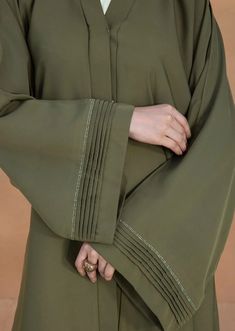 Olive : Button Through Abaya – Isloou.com Simple Abaya Design, Abaya Sleeve Design Muslim, Simple Abaya Designs Casual, Abaya Sleeves Design, Abaya With Buttons, Pretty Abayas, Trendy Abaya Designs, Abaya Sleeves, Colored Abaya