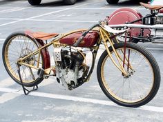 an antique motorcycle parked in a parking lot