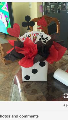 a white box filled with lots of cards sitting on top of a table next to a remote control