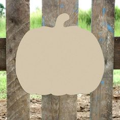 a wooden fence with a pumpkin cut out on it