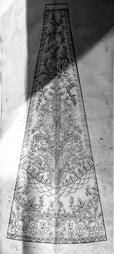 an intricately designed table runner is shown in black and white