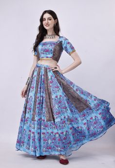 Step into the enchanting world of Navratri with our exquisite Blue and Grey Chaniya Choli set. This stunning ensemble is meticulously crafted to make your celebrations truly special. 🌟 Choli: Our Choli is made from luxurious Blue hammered satin, featuring an alluring open back design secured with delicate dori ties, ensuring a perfect fit. 🌸 Chaniya: The Chaniya boasts the same Hammered Satin Blue and Printed Grey Muslin fabric, harmoniously blended to create a visual masterpiece that reflects the spirit of Navratri. 🧣 Graceful Dupatta: Adorned with a Grey printed pure Chiffon dupatta, this set exudes grace and sophistication, completing your Navratri look with finesse. 🪔 Unforgettable Navratri: Elevate your Navratri celebrations with this exceptional Chaniya Choli set, designed to mak Cheap Blue Choli For Navratri, Blue Bohemian Traditional Wear For Wedding, Bohemian Blue Traditional Wear For Wedding, Bohemian Art Silk Sets For Navratri, Bohemian Art Silk Pre-draped Saree For Wedding, Navratri Festival Art Silk Lehenga, Bohemian Blue Anarkali Set With Pallu, Bohemian Kalamkari Print Lehenga For Festive Occasions, Bohemian Kalamkari Lehenga For Festive Occasions