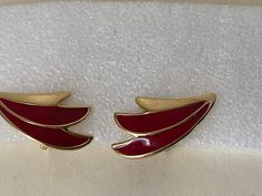 "Monet red enamel, gold plated earrings. Clip-on Marked: Monet copyright symbol. Very good condition. size - 1 1/2\" x 3/4\" 000660" Red Enamel Clip-on Jewelry, Formal Enamel Clip-on Earrings, Enamel Clip-on Earrings For Evening, Gold Enamel Clip-on Earrings, Formal Enamel Earrings Hallmarked, Red Enamel Clip-on Earrings, Red Clip-on Earrings For Formal Occasions, Red Enamel Earrings For Anniversary, Copyright Symbol