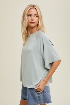 Sage green relaxed fit, boxy short sleeve top The perfect happy balance of comfort and style - Casual Happiness! Relaxed, boxy top featuring a sleek knit fabric, crew neckline, and short sleeves with drop shoulder. Bring a touch of happiness to all of your casual outings! Boxy, relaxed fit Model is wearing a small Fabric contains stretch Crew neckline Short sleeves with drop shoulder Small length: 23" from top of shoulder to bottom hem in front 72% Bamboo, 23% Polyester, 5% Spandex Gentle wash c Tops To Wear With Jeans, Boxy Top, Trendy Fall Outfits, Vintage Couture, Vintage Havana, Cute Comfy, Comfy Tops, Trendy Fall, Dressy Tops