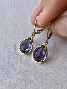 Amethyst Earrings, February Birthstone, Purple Teardrop Gem Earrings in Gold or Silver, Purple Jewelry, Lavender Earrings, Gift for women These small but gorgeous earrings feature deep purple amethyst teardrops bezel framed in either 14k gold filled or sterling silver. The teardrops are suspended form lever back ear wires in the finish of your choice. These are small, delicate and dainty earrings but with a gorgeous lavender color sure to match many outfits. Ideal for a girl or a women that like Lavender Drop Earrings For Formal Occasions, Lavender Dangle Earrings For Formal Occasion, Elegant Lavender Drop Earrings, Elegant Amethyst Teardrop Dangle Earrings, Elegant Lavender Earrings With Ear Wire, Formal Amethyst Teardrop Earrings, Formal Teardrop Amethyst Earrings, Elegant Lavender Dangle Crystal Earrings, Elegant Lavender Crystal Dangle Earrings